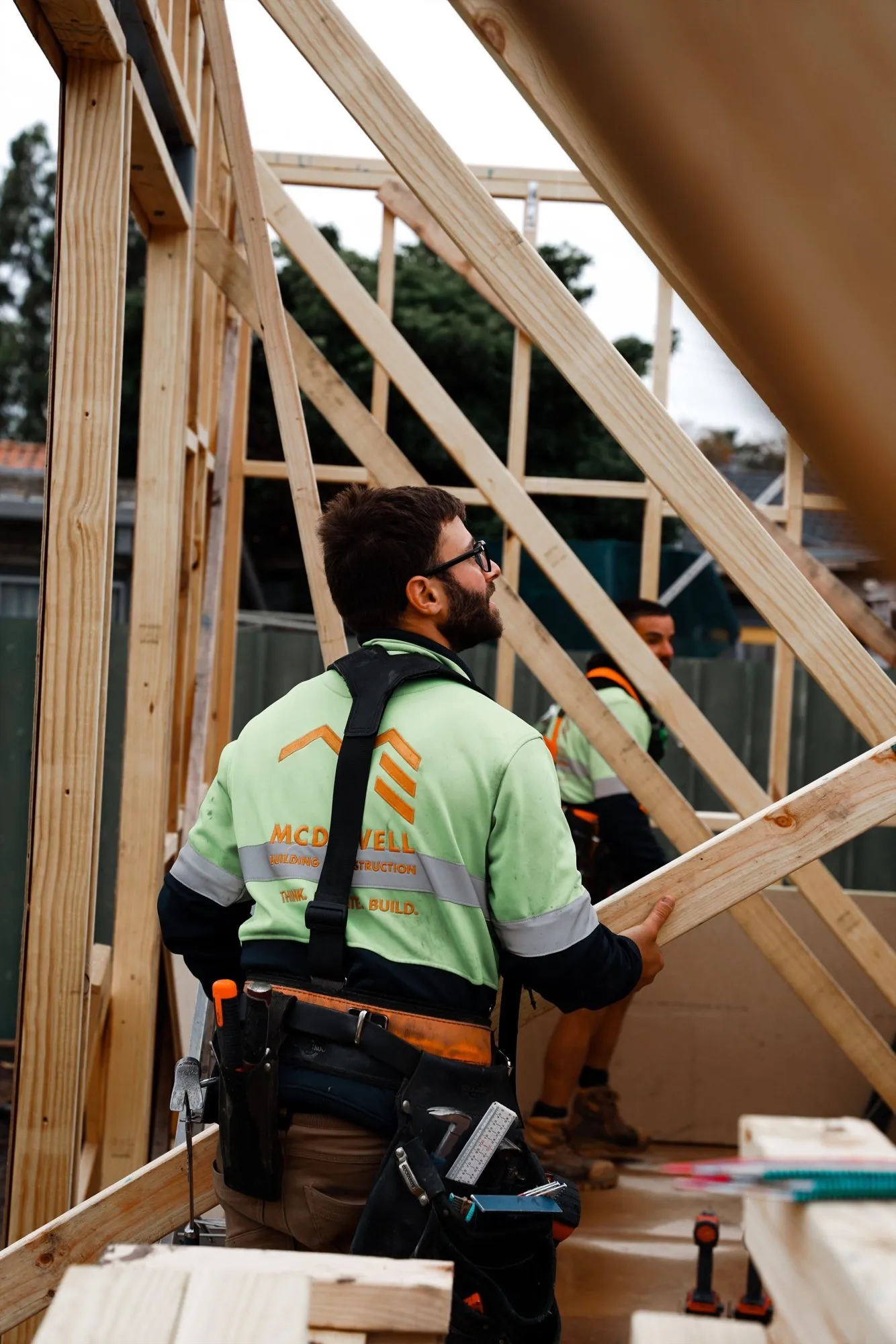 A McDowell carpenter setting out roof framing on site